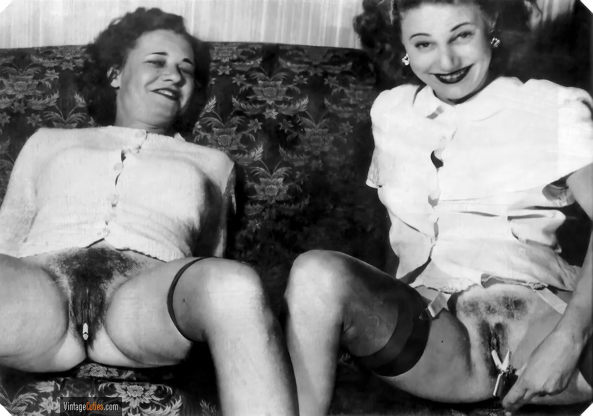 Cigarettes are sticked into a couple of vintage hairy pussies