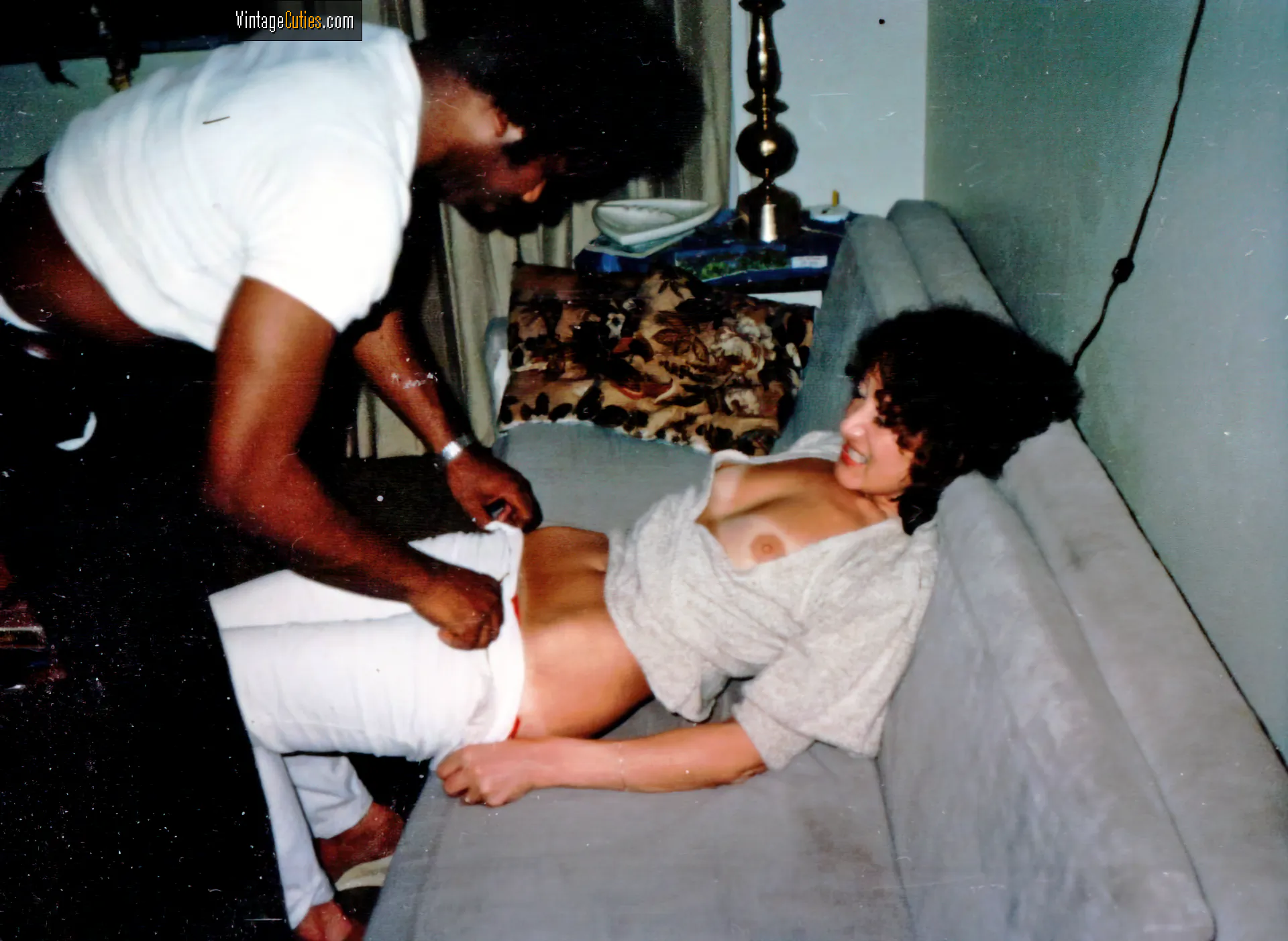 Classic homemade sex: dark-skinned guy slowly undresses his girlfriend