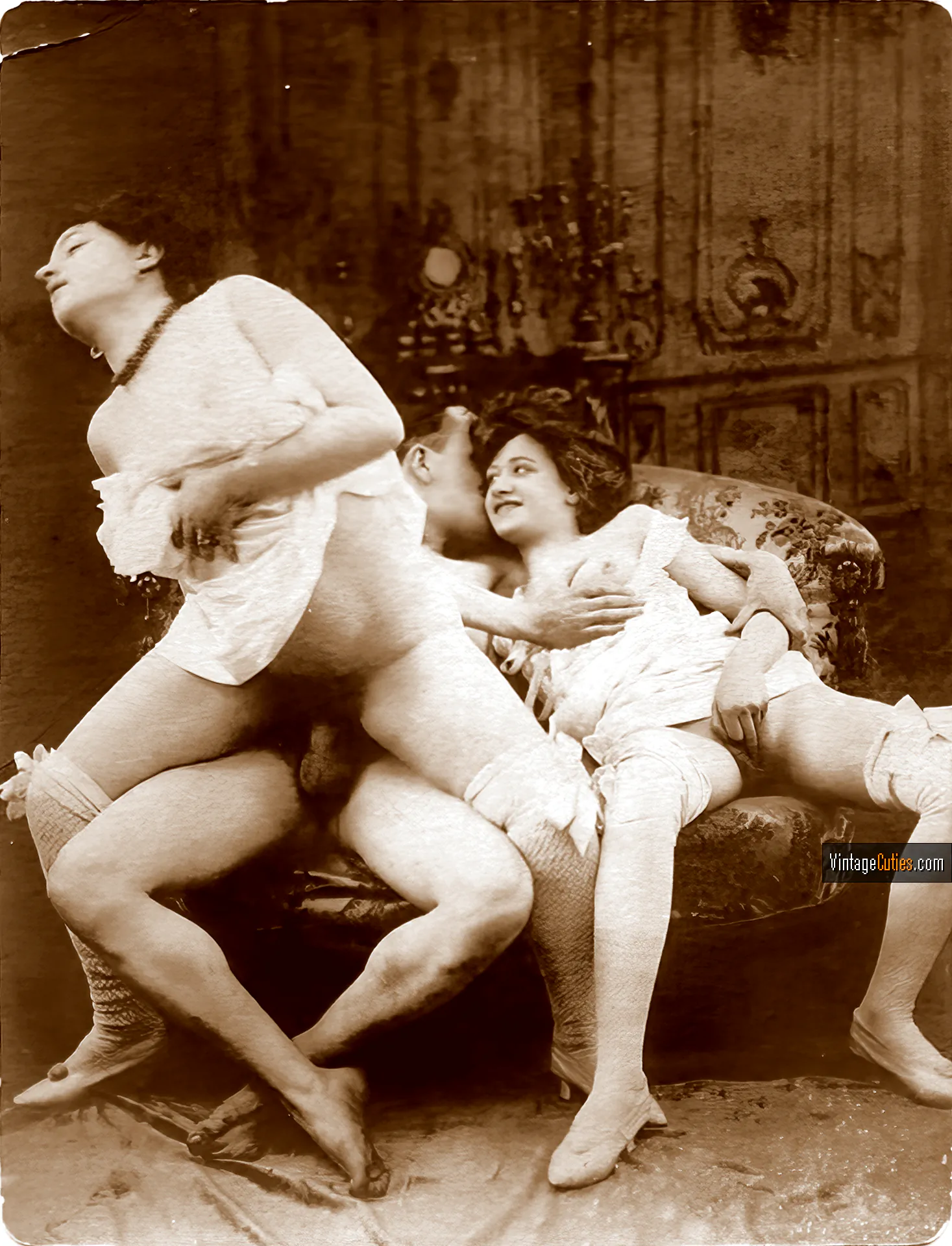 Antique porn: maid rides an erect cock while her girlfriend touches herself