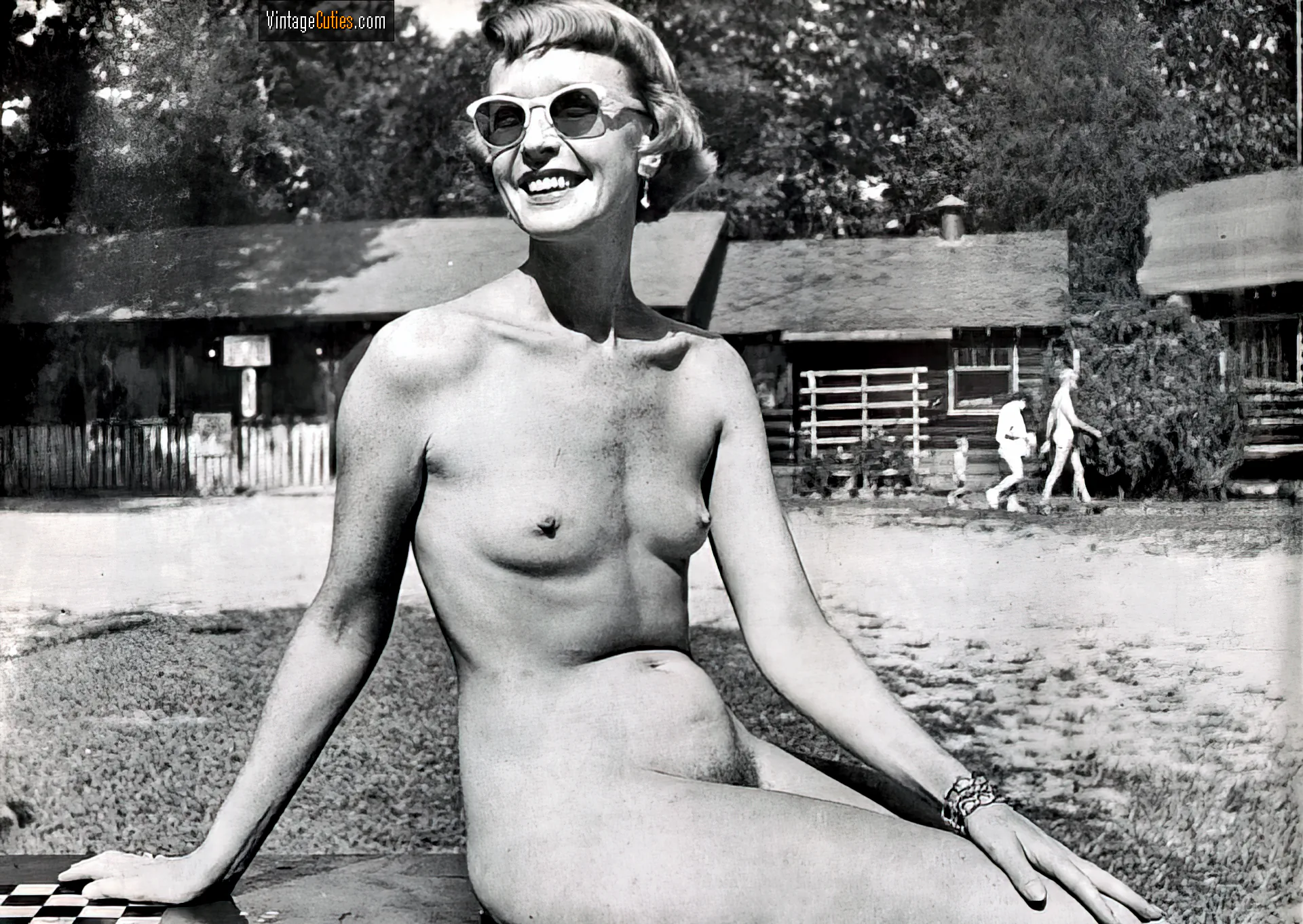 Skinny vintage honey with small tits poses in her sunglasses