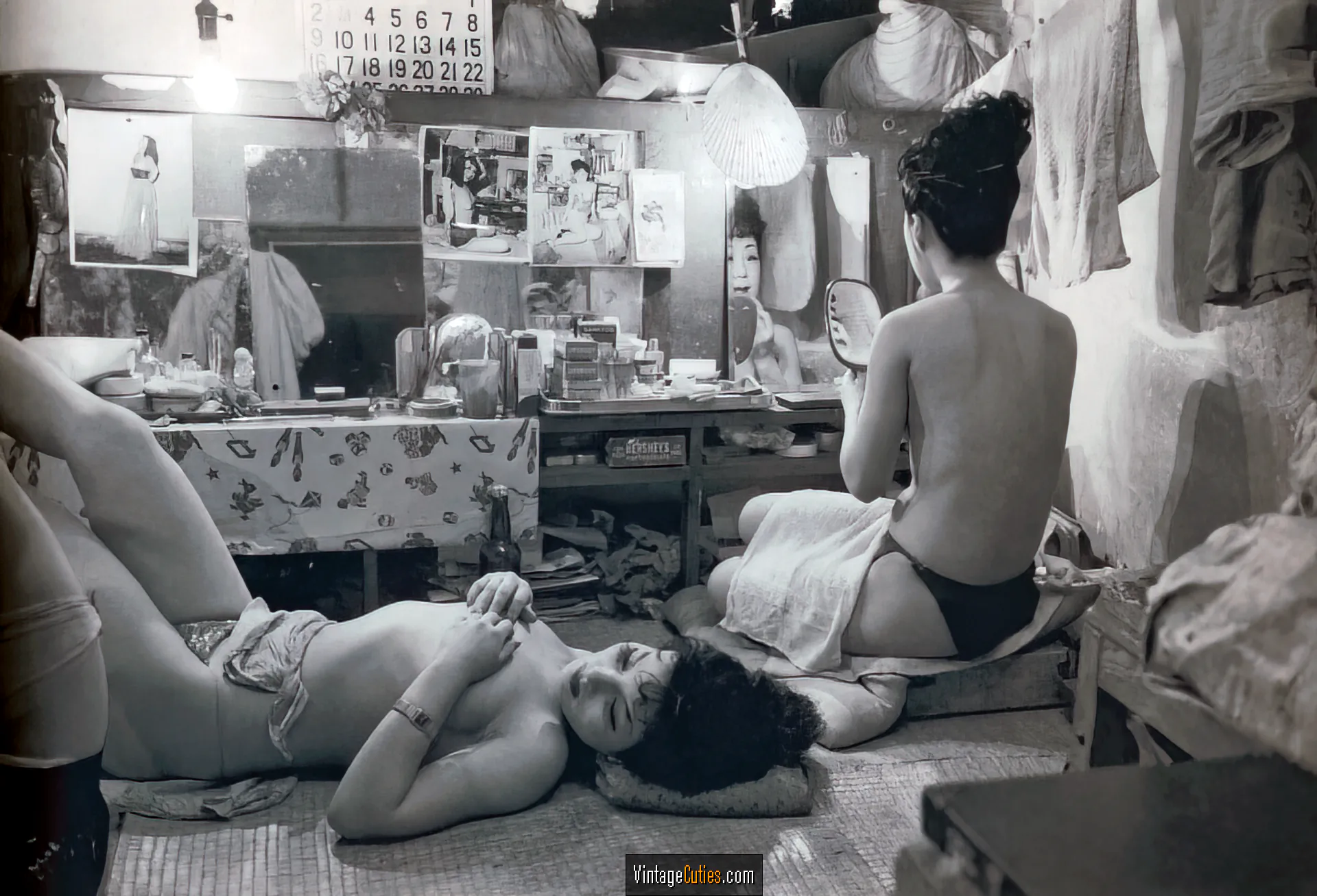 Sexy topless burlesque girls rest in their dressing room
