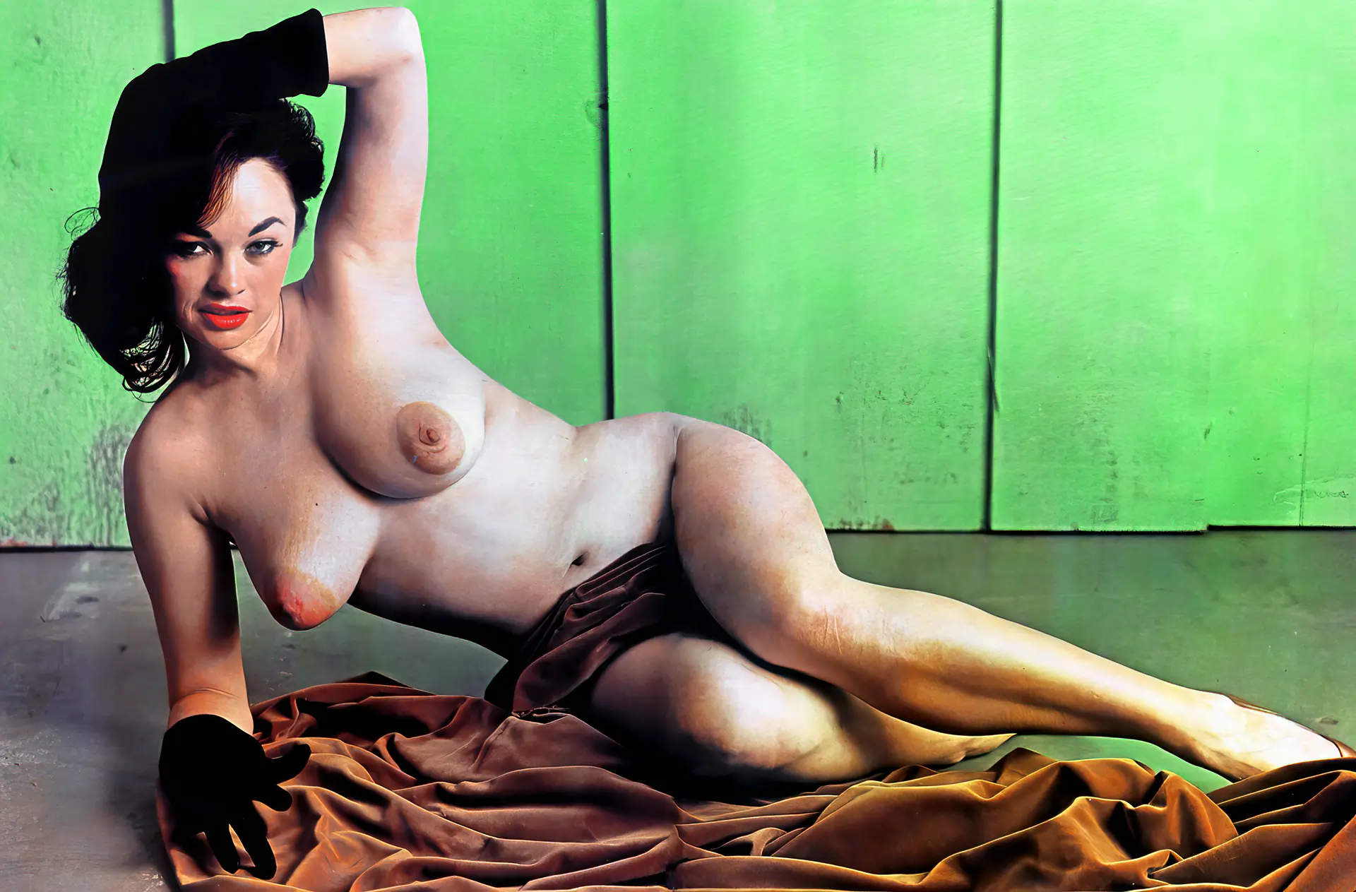 Beautiful Bonnie Logan with a satin scarf covering her pussy lying topless on the floor