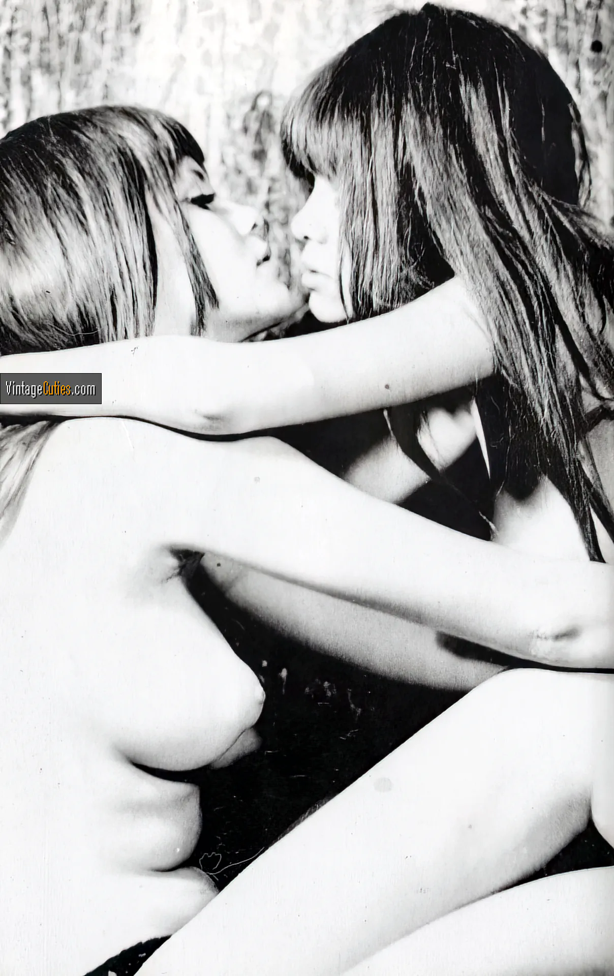 Dreamy Collinson Twins posing in a sensual embrace