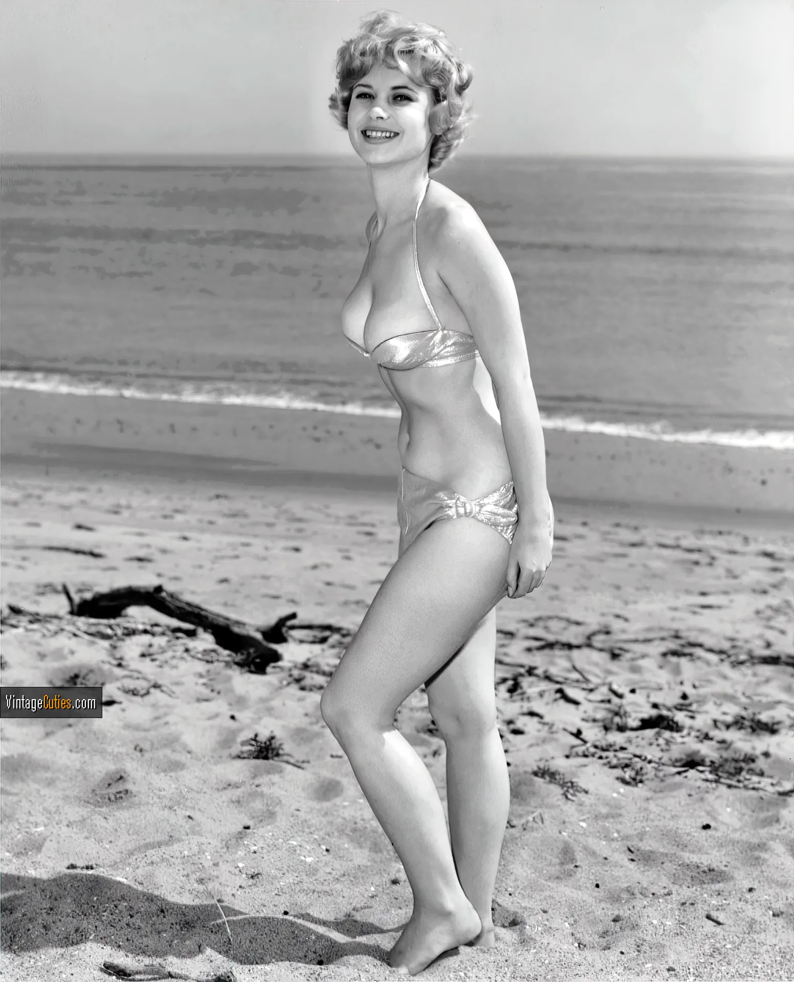Flirty Gloria Dawn posing in her tiny bikini