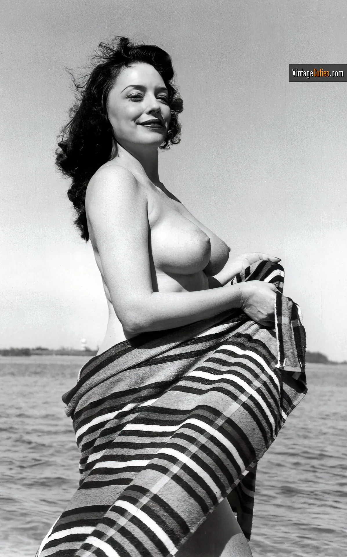 Evelyn West with big tits covers her curves