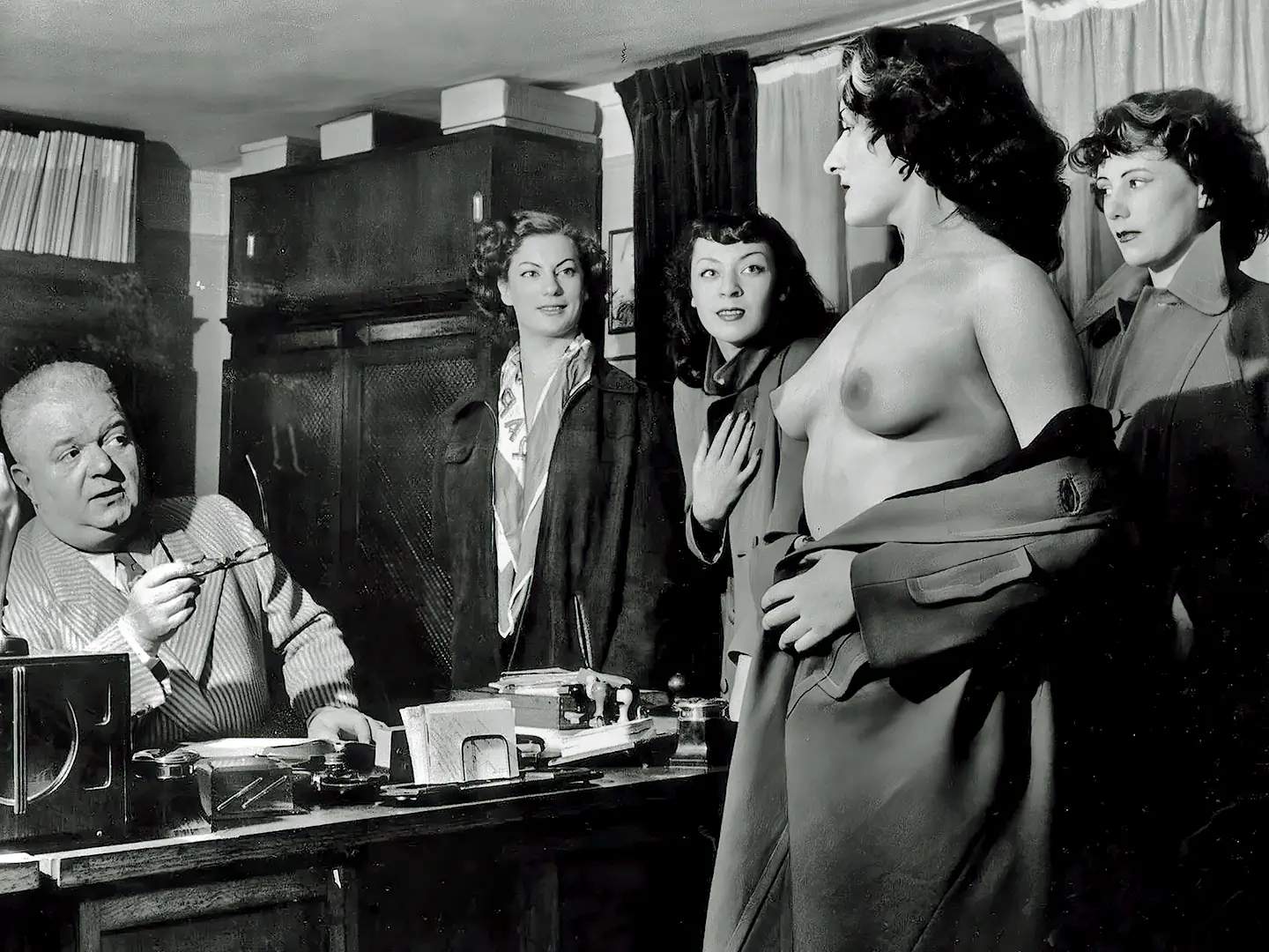 Vintage secretary porn videos with old fat boss observing his new secretary's bare breasts in his office with 3 other women watching